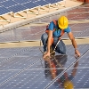A worker supervising a photovoltaic instalation