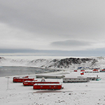 Small image of a base in Antarctica with buildings in the snow 