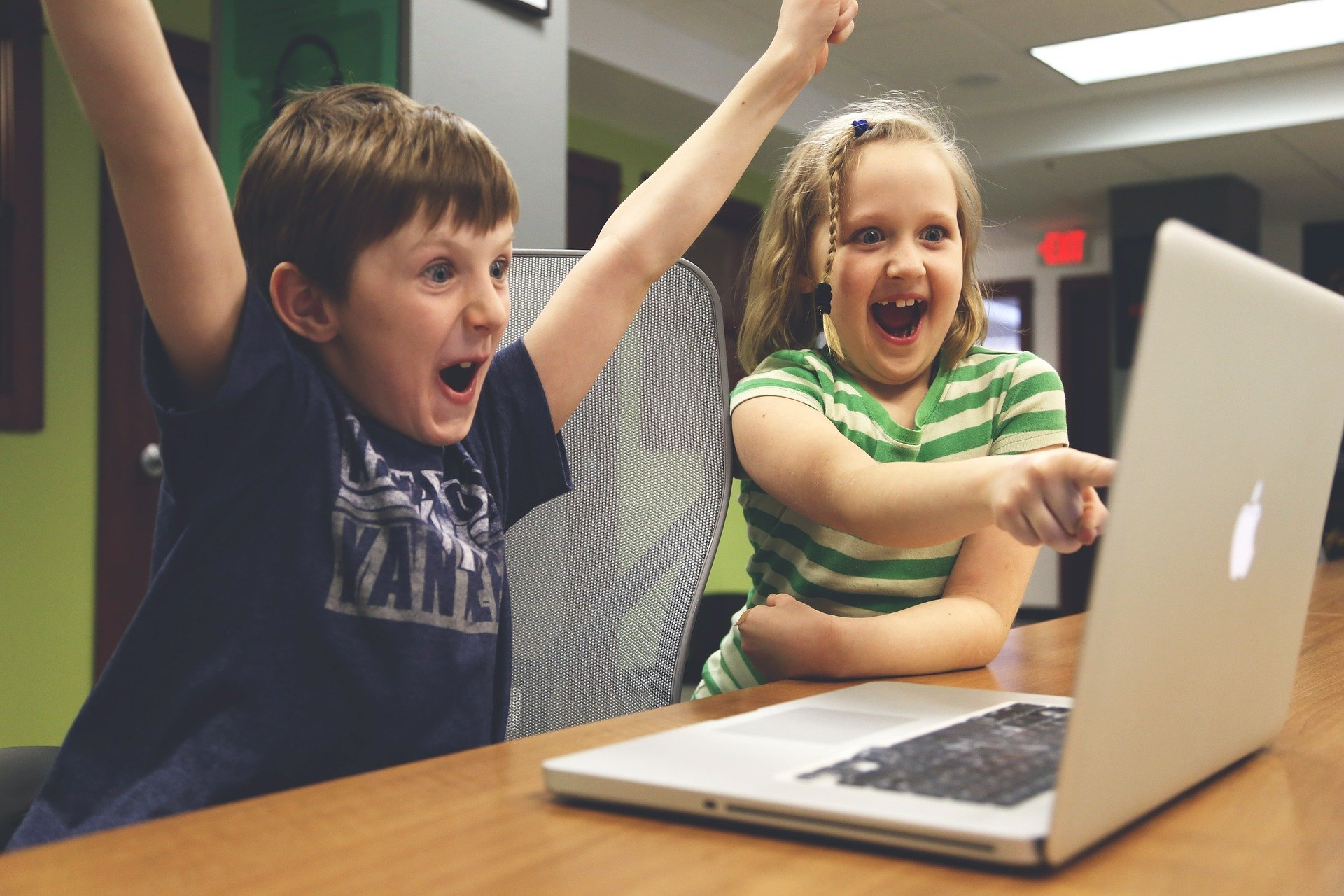 Children on computer excited
