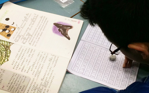 Student studying Chinese characters