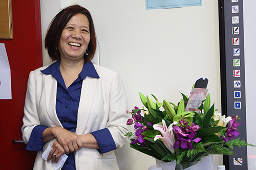 Ien Ang with her flowers at her farewell as Director morning tea.