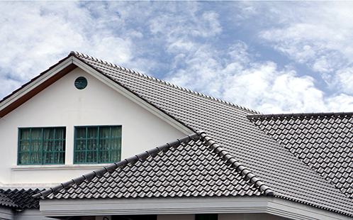 Grey house roof with sky
