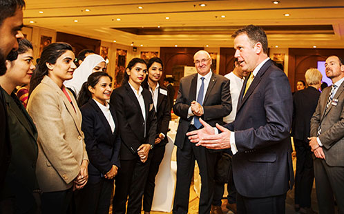Dan Tehan, Education Minister, speaks with delegates at the India launch