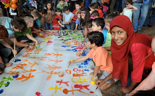Children gather to paint and celebrate Harmony Day