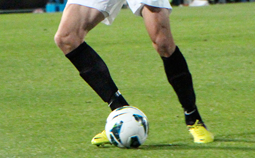 Player and a soccer ball